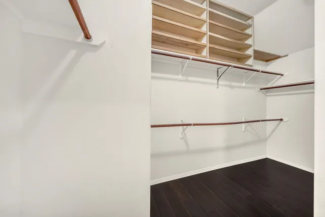 a view of an empty walk in closet