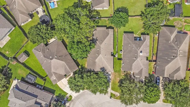 an aerial view of a house with outdoor space