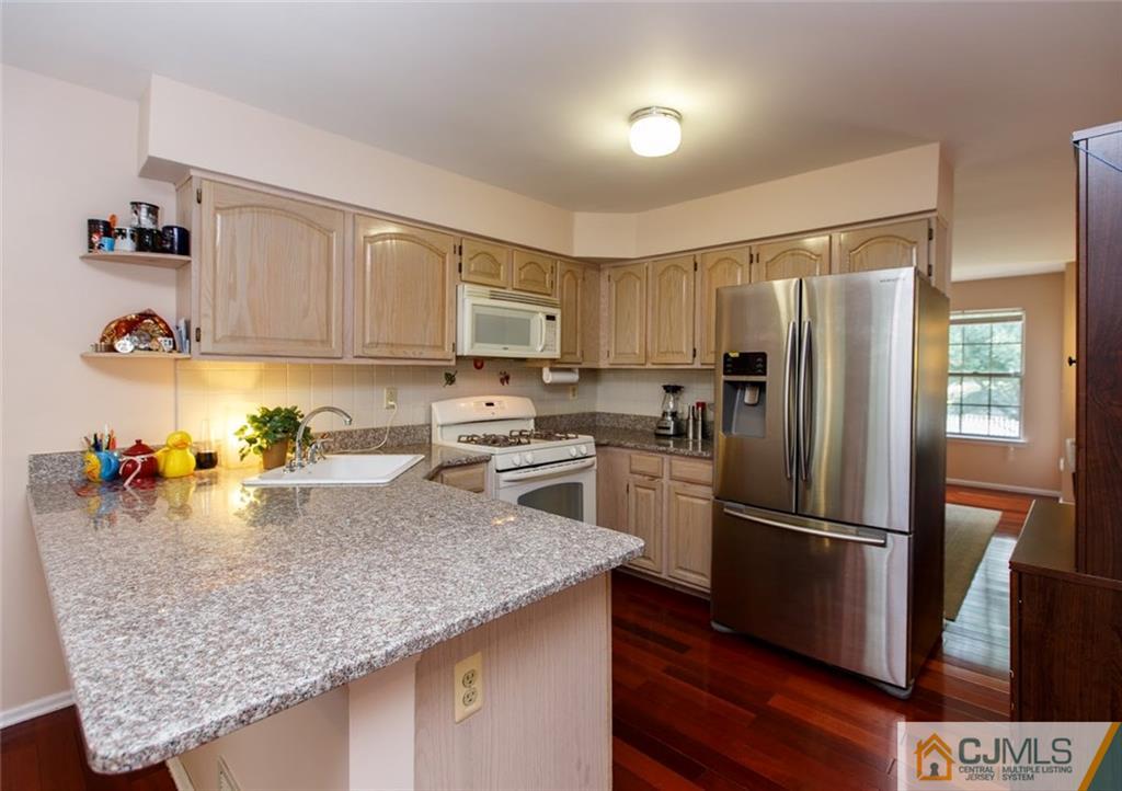 175 Salem Road North Brunswick, NJ 08902 - Photo 3 of 23 a kitchen with refrigerator and a sink