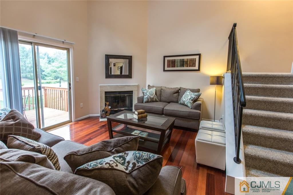 175 Salem Road North Brunswick, NJ 08902 - Photo 5 of 23 a living room with furniture and a fireplace