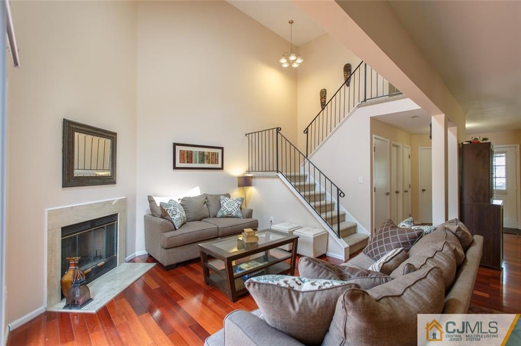 175 Salem Road North Brunswick, NJ 08902 - Photo 6 of 23 a living room with furniture and a fireplace