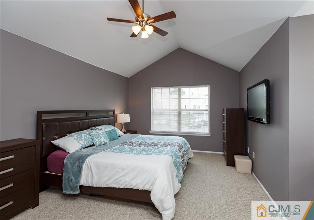 175 Salem Road North Brunswick, NJ 08902 - Photo 9 of 23 a bedroom with a bed and a flat screen tv