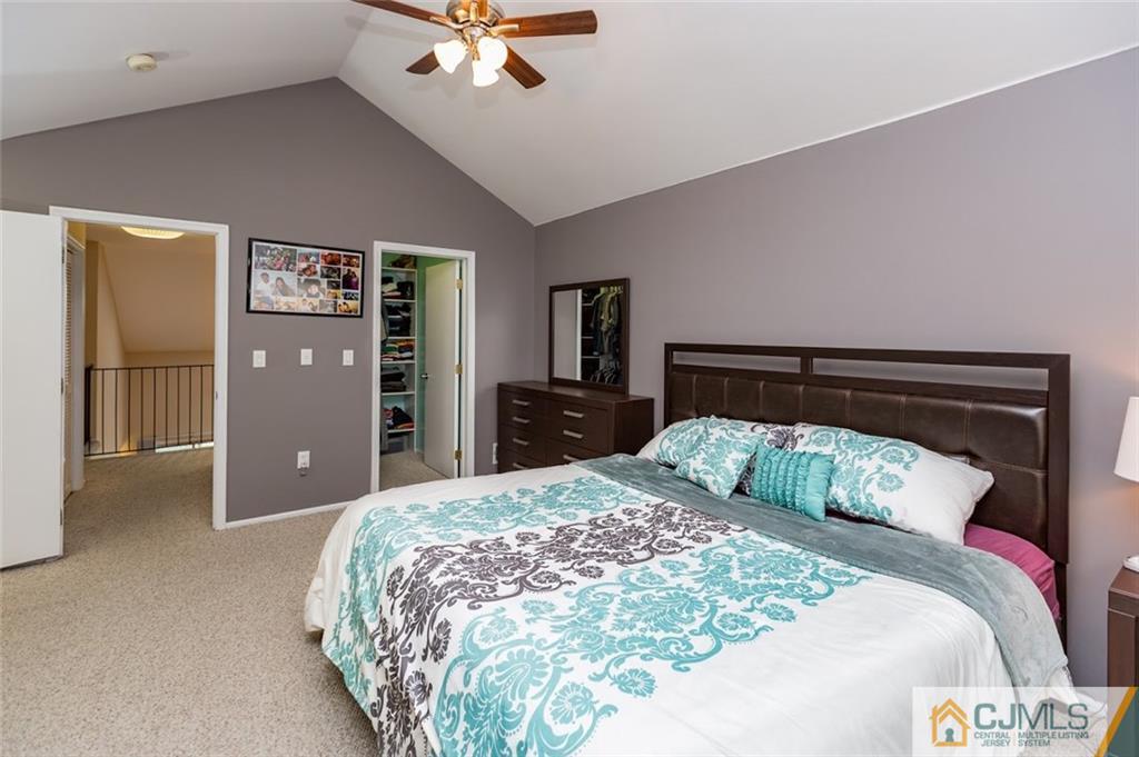 175 Salem Road North Brunswick, NJ 08902 - Photo 10 of 23 a bedroom with a large bed and a chandelier