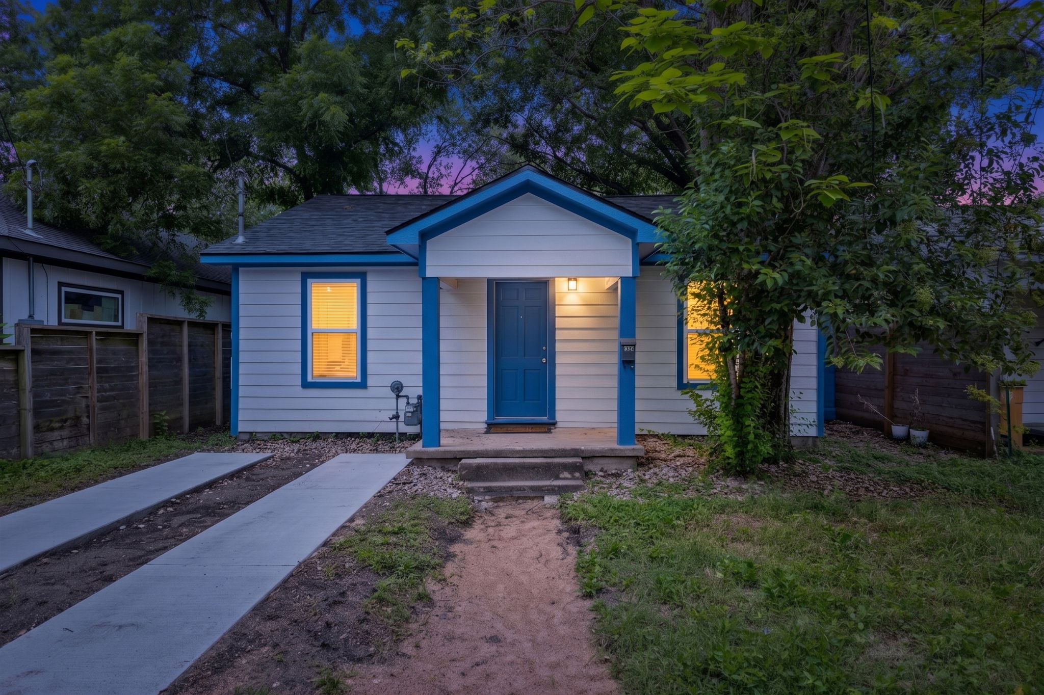 907 East 53rd Street Austin, TX 78751 - Photo 35 of 36 A welcoming facade with a covered porch and dual concrete driveways awaits.