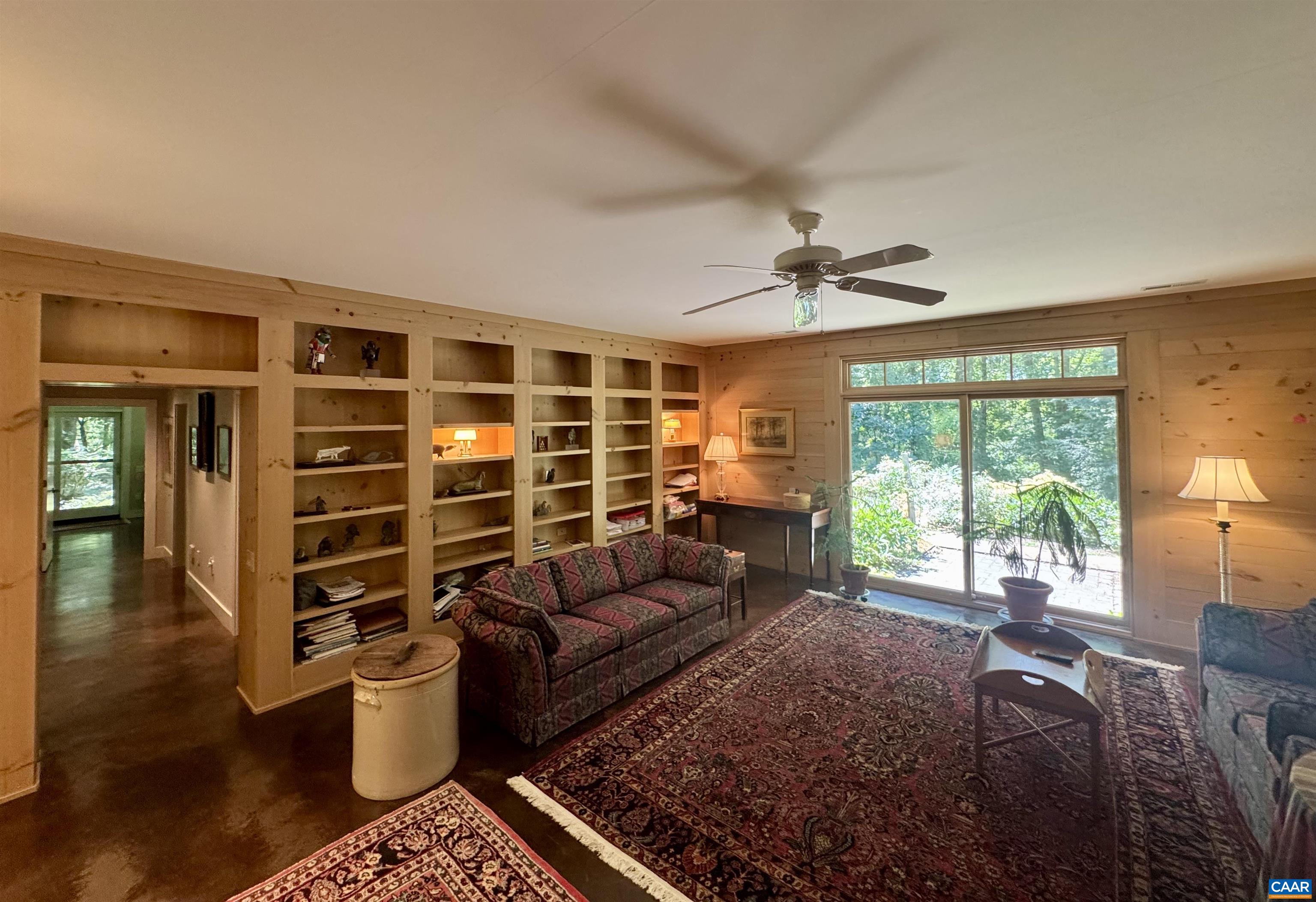 889 Old Garth Road Charlottesville, VA 22901 - Photo 19 of 35 a living room with furniture a ceiling fan and a window