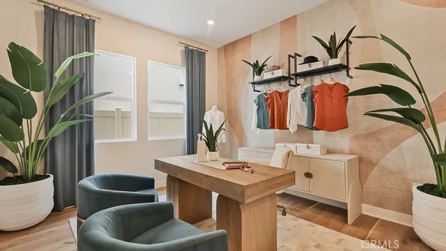 a living room with furniture and a potted plant