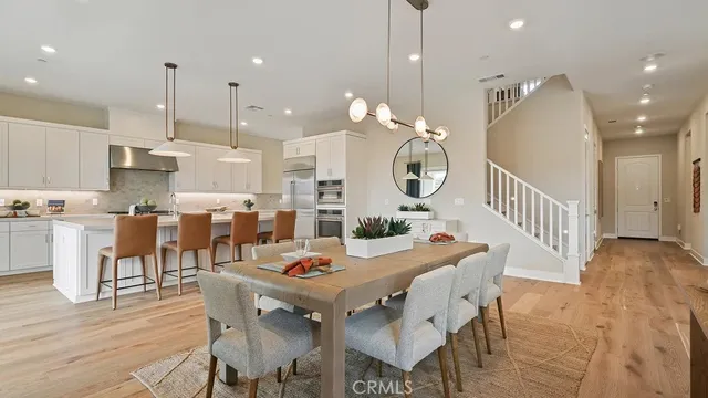 a open kitchen with a table and chairs in it