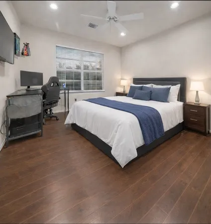 a bedroom with bed and window