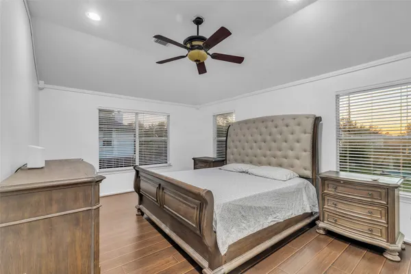 a bedroom with a bed and window