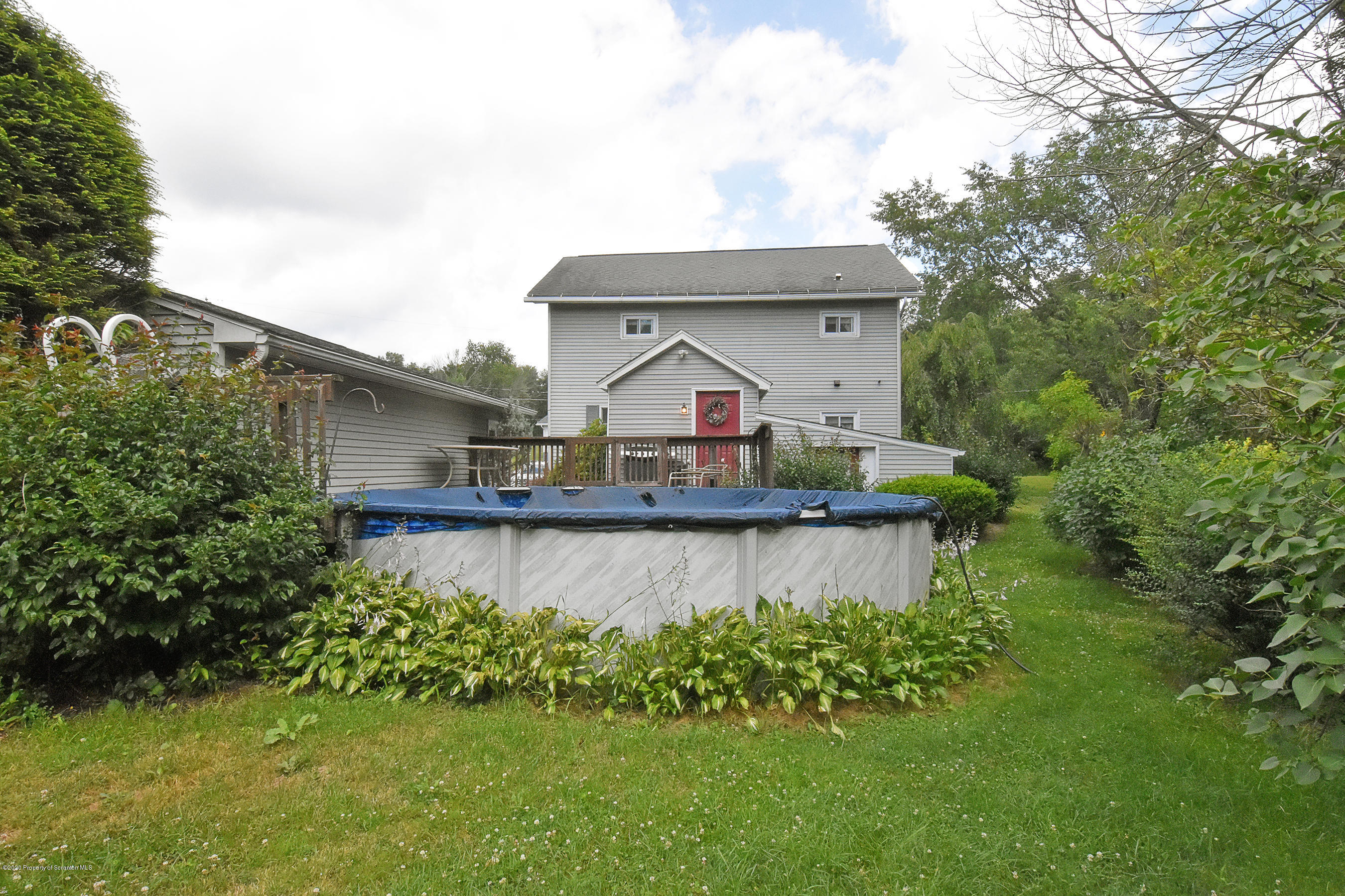 614 State Rte 1014 Nicholson, PA 18446 - Photo 21 of 23 a front view of a house with a garden and yard