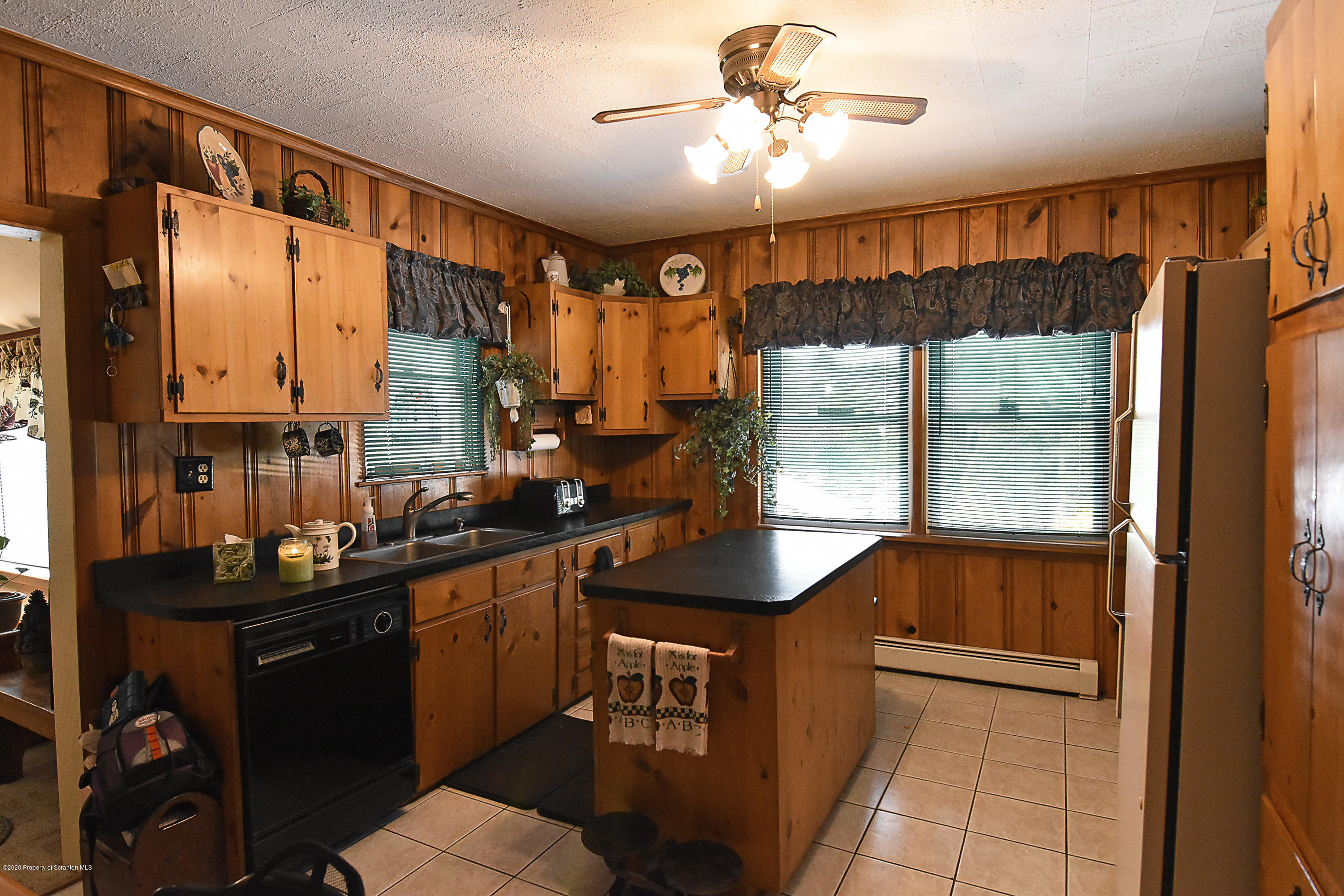 614 State Rte 1014 Nicholson, PA 18446 - Photo 7 of 23 a kitchen with a sink a counter top space and stainless steel appliances