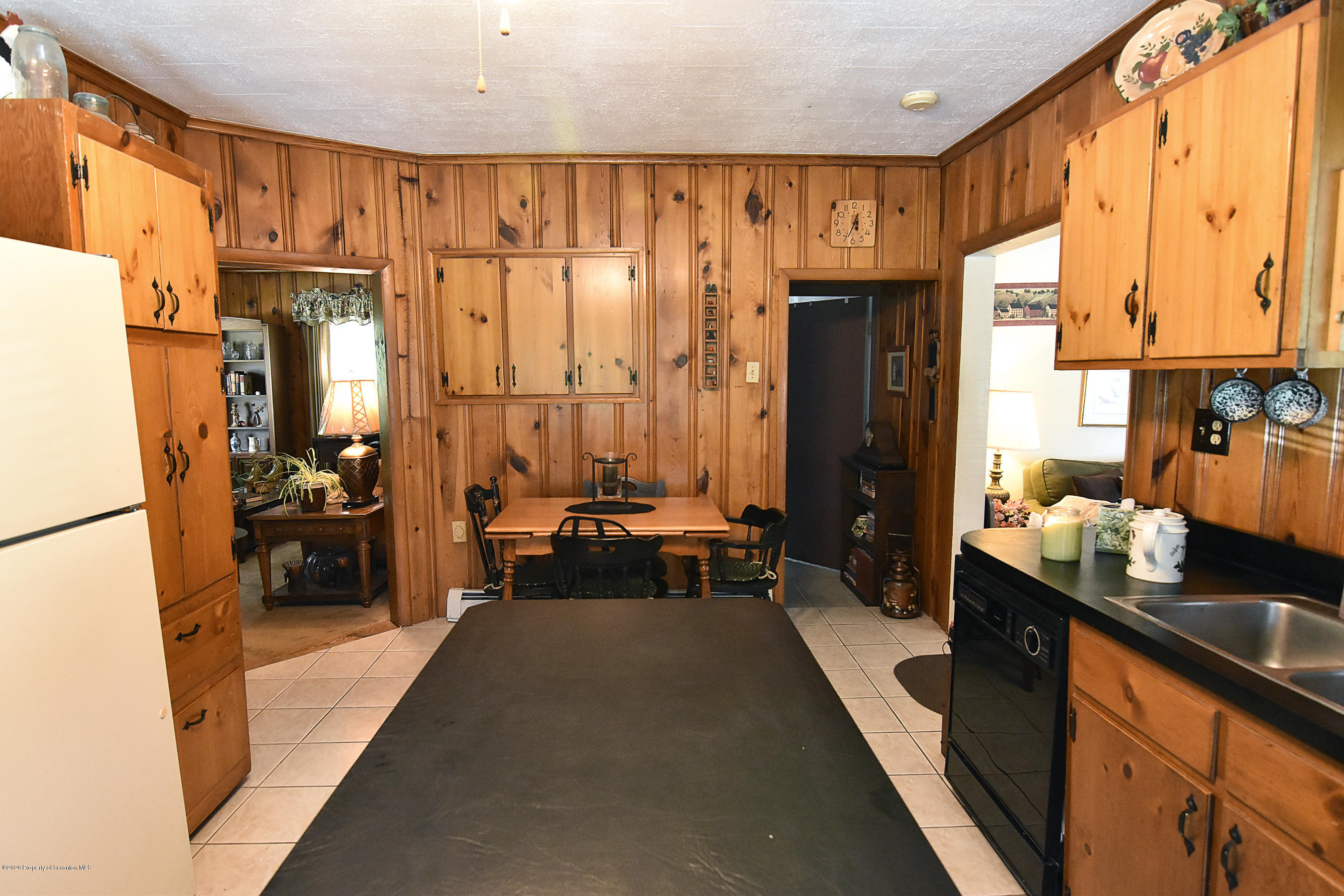 614 State Rte 1014 Nicholson, PA 18446 - Photo 8 of 23 a large living room with stainless steel appliances furniture a large window and a couch
