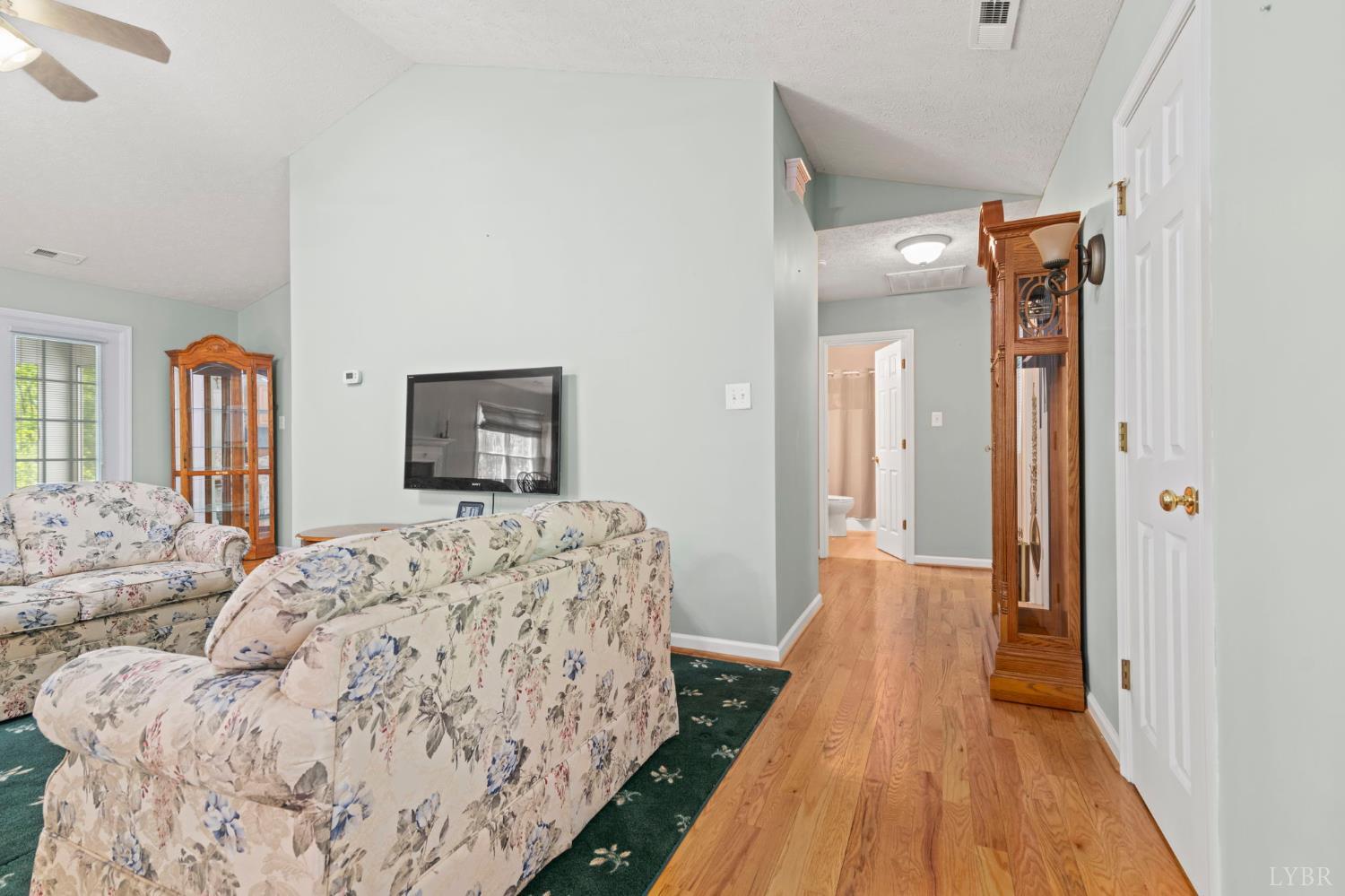298 Braxton Ridge Road Amherst, VA 24521 - Photo 28 of 65 a bedroom with a bed and wooden floor