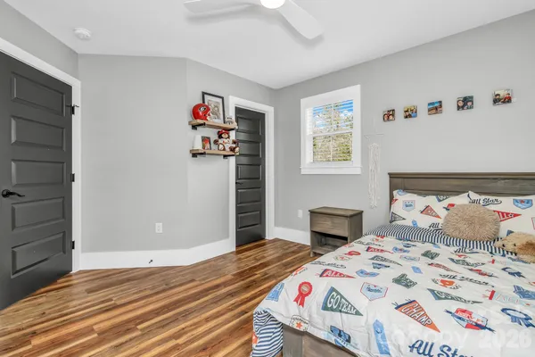 a bedroom with a bed and cabinets