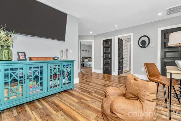 a view of an entryway with wooden floor