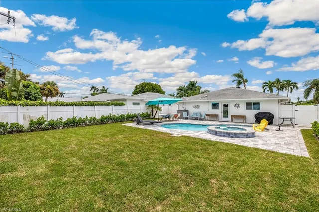 a front view of house with yard and seating