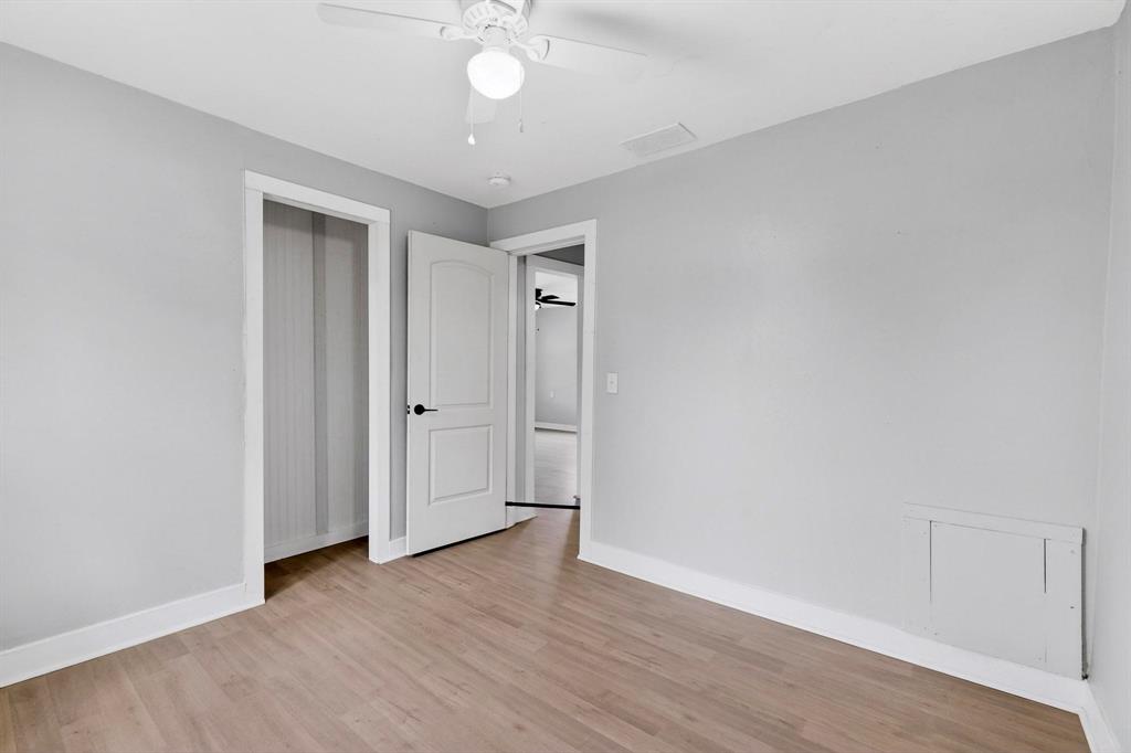 313 Farm To Market 316 Eustace, TX 75124 - Photo 28 of 33 a view of an empty room with wooden floor