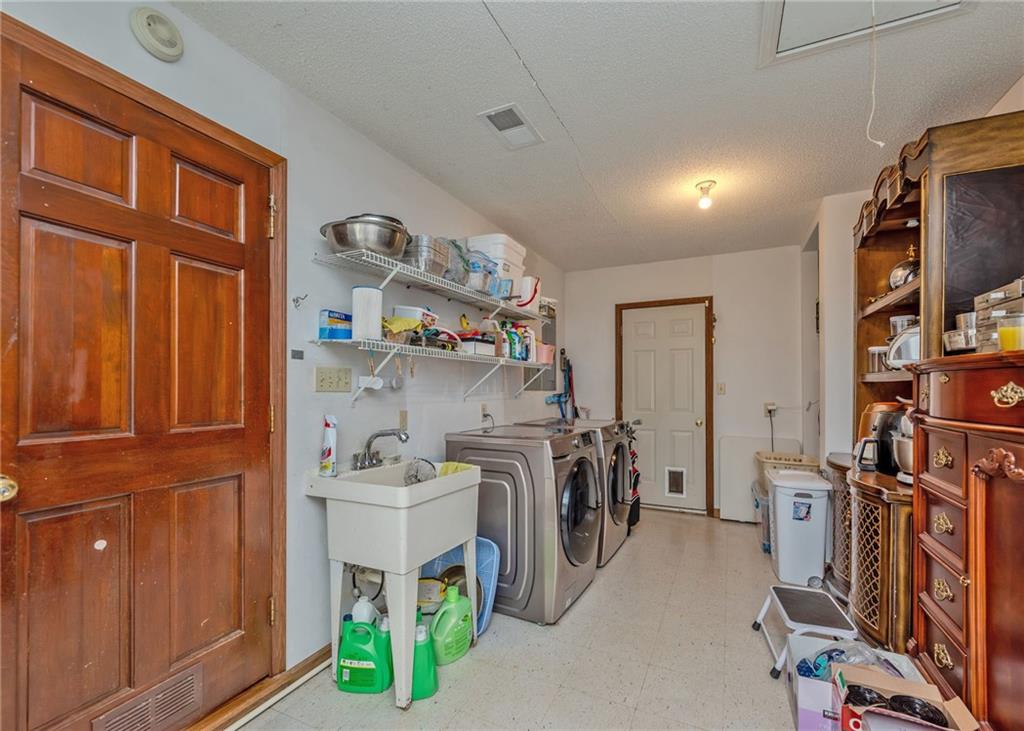 7 Old Oak Trail Hartwell, GA 30643 - Photo 19 of 59 a storage room with washer and dryer
