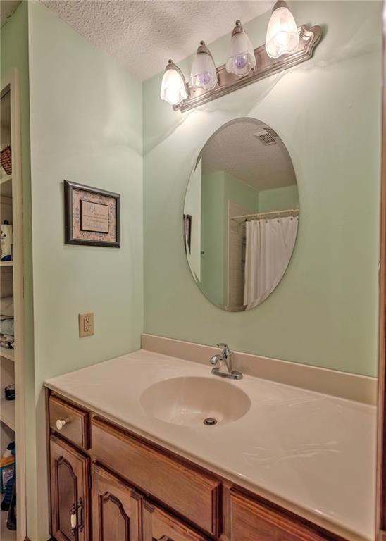7 Old Oak Trail Hartwell, GA 30643 - Photo 21 of 59 a bathroom with a sink and a mirror