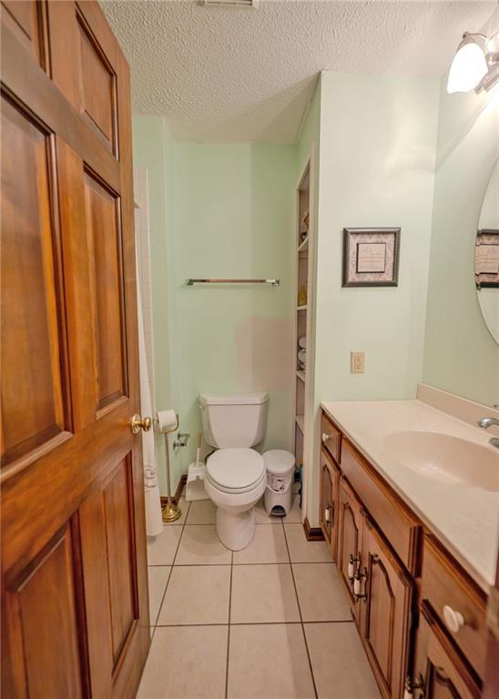 7 Old Oak Trail Hartwell, GA 30643 - Photo 22 of 59 a bathroom with a sink a toilet and a shower