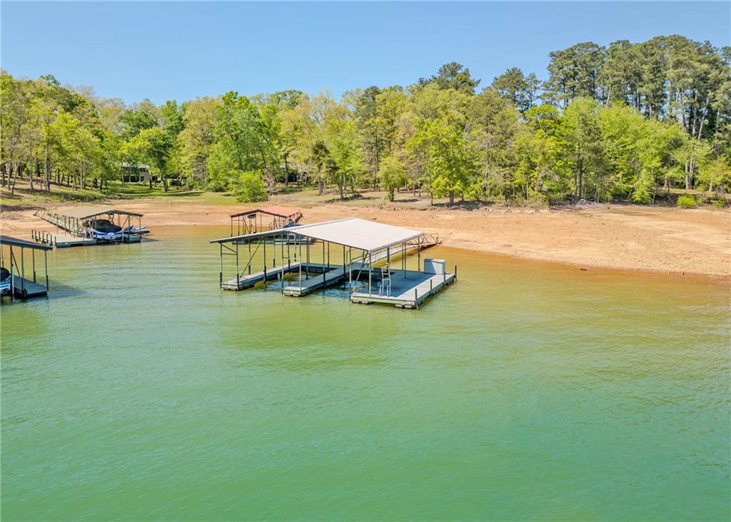 7 Old Oak Trail Hartwell, GA 30643 - Photo 33 of 59 a view of a lake with houses in the back