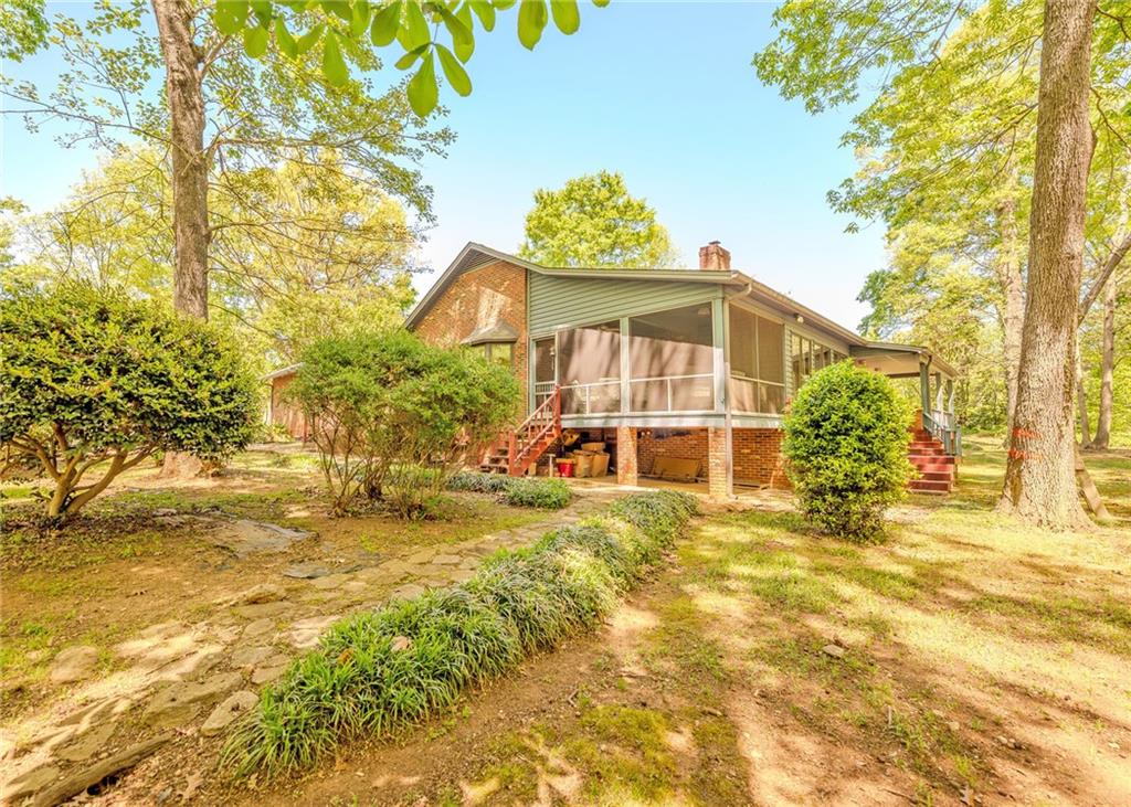 7 Old Oak Trail Hartwell, GA 30643 - Photo 42 of 59 a view of a big yard with large trees