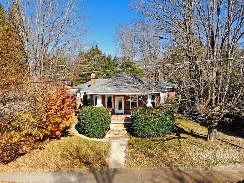 218 West Main Street Brevard, NC 28712 - Photo 1 of 48 a view of a house with a yard and potted plants