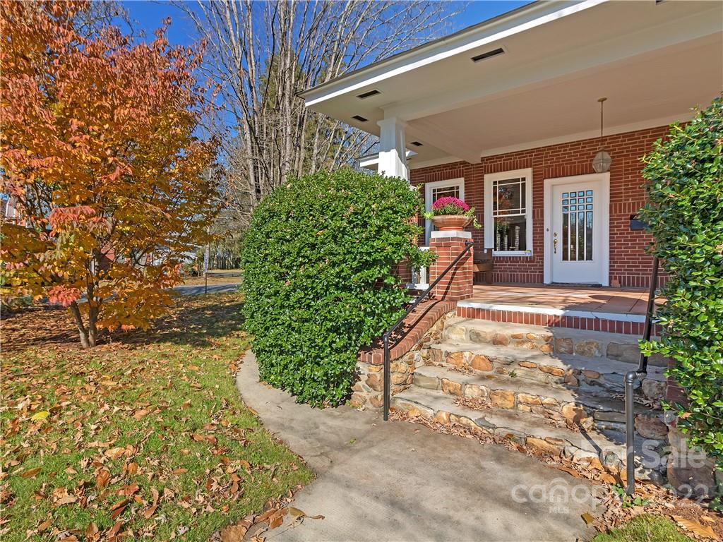 218 West Main Street Brevard, NC 28712 - Photo 13 of 48 a front view of a house with a yard