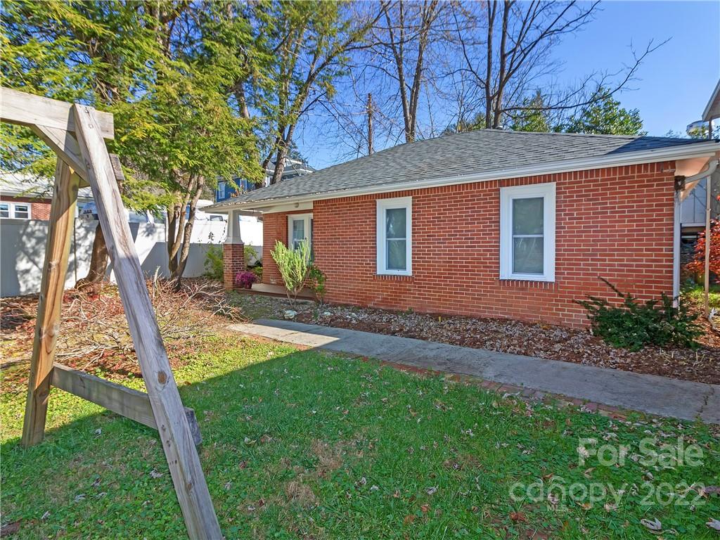 218 West Main Street Brevard, NC 28712 - Photo 15 of 48 a front view of a house with a yard