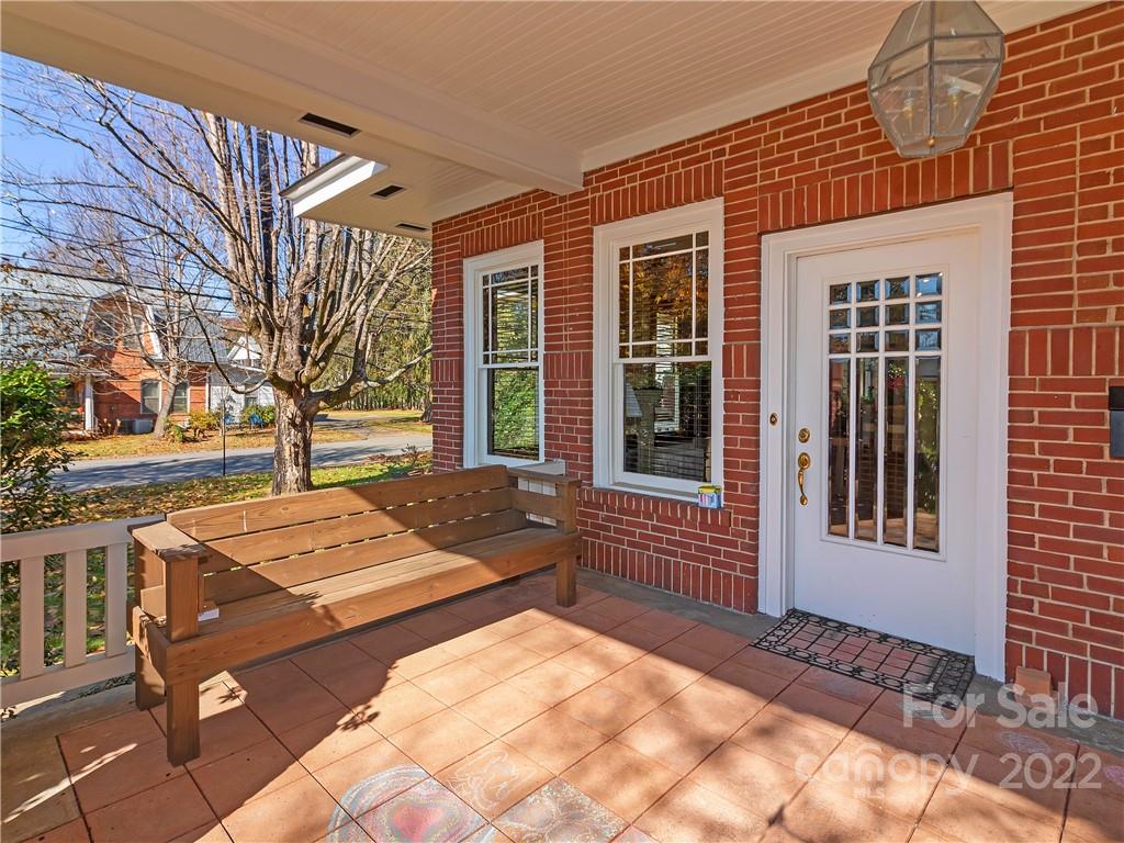 218 West Main Street Brevard, NC 28712 - Photo 16 of 48 a view of a backyard with a table and chairs