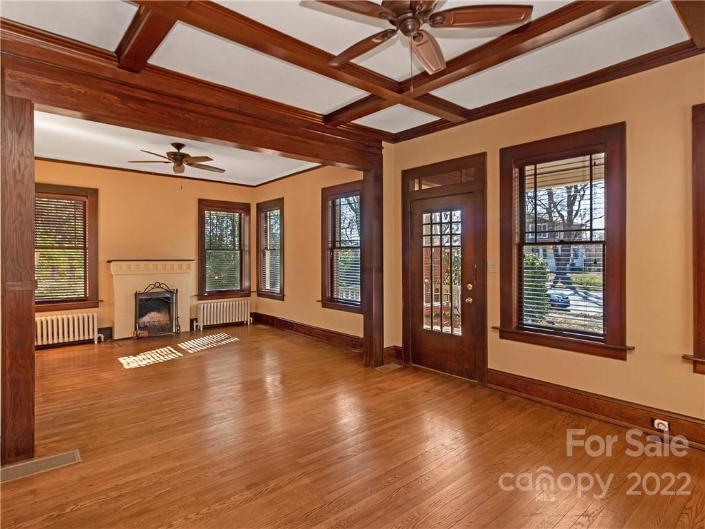 218 West Main Street Brevard, NC 28712 - Photo 17 of 48 a view of an empty room with wooden floor and a window
