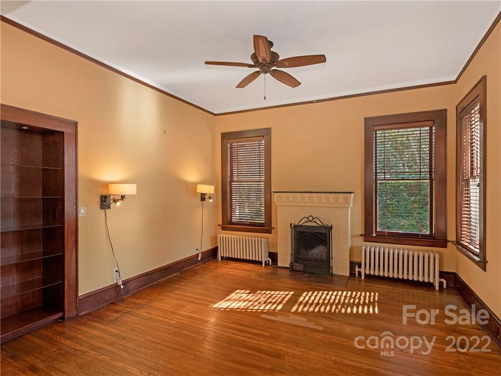 218 West Main Street Brevard, NC 28712 - Photo 19 of 48 a bedroom with a bed and a window