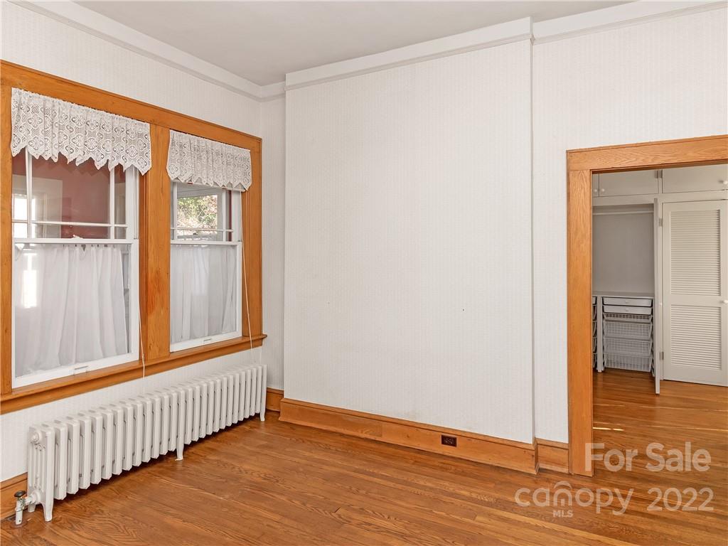 218 West Main Street Brevard, NC 28712 - Photo 29 of 48 a view of an empty room with wooden floor