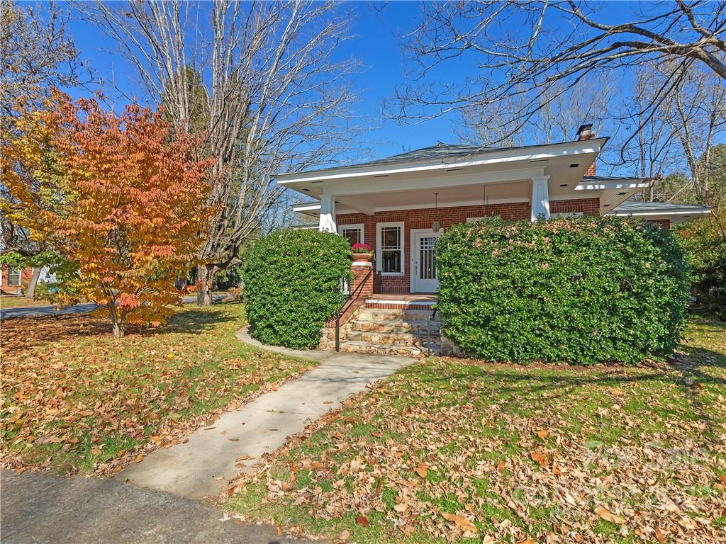 218 West Main Street Brevard, NC 28712 - Photo 3 of 48 a view of a house with a yard