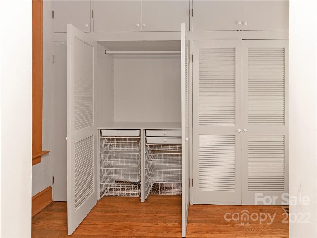 218 West Main Street Brevard, NC 28712 - Photo 31 of 48 a view of walk in closet with empty racks