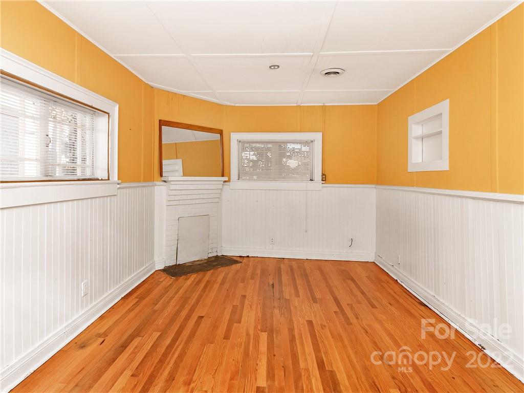 218 West Main Street Brevard, NC 28712 - Photo 40 of 48 a view of a big room with wooden floor and windows