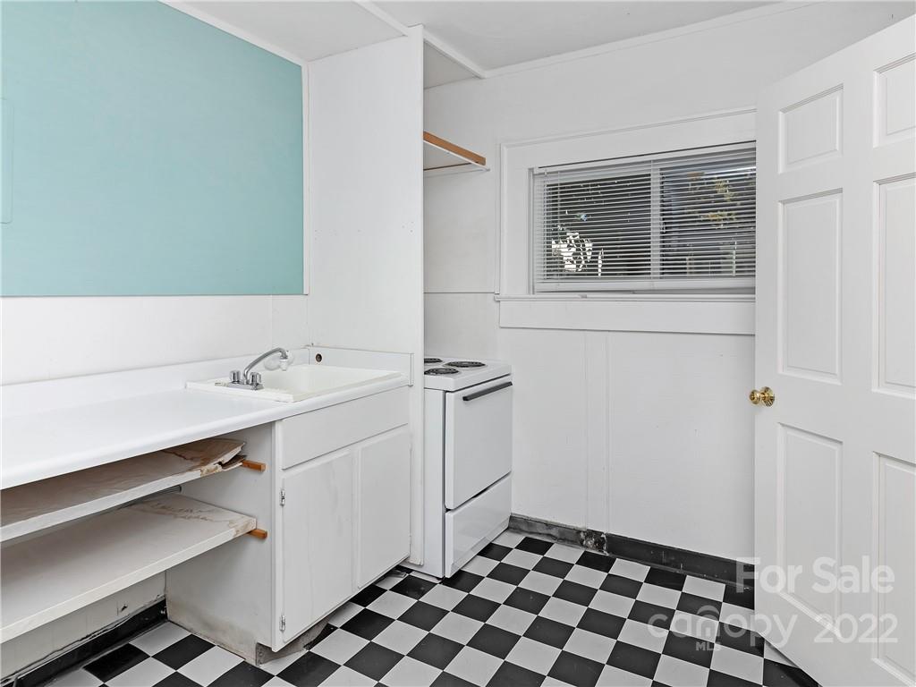 218 West Main Street Brevard, NC 28712 - Photo 41 of 48 a room with a sink and a mirror
