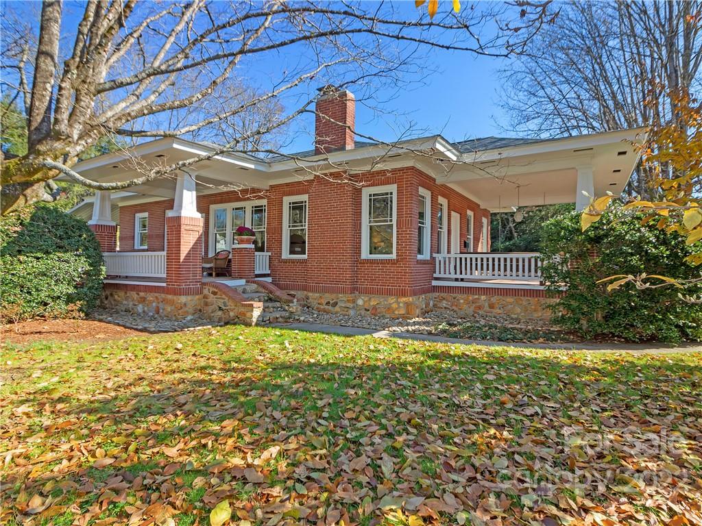218 West Main Street Brevard, NC 28712 - Photo 6 of 48 a front view of a house with a yard