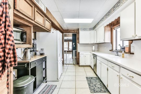 541 South Allen Street Ridgecrest, CA 93555 - Photo 15 of 41 a kitchen with a sink appliances and cabinets