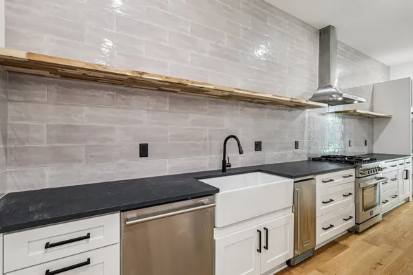 a white bath tub sitting in a bathroom