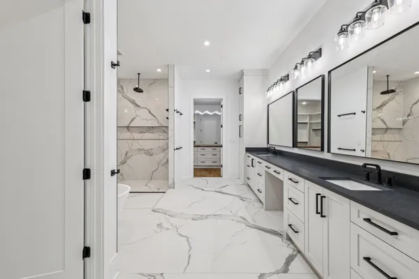 a view of an empty room with a fireplace and a window