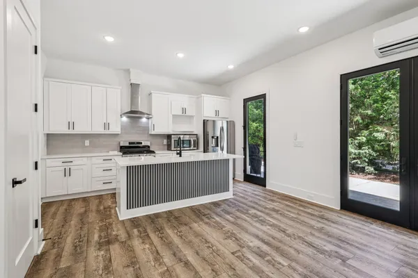 a bathroom with a glass door shower