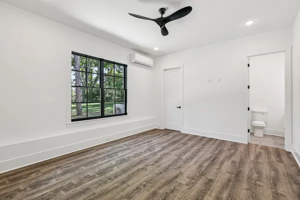 a view of a kitchen with a stove cabinets and a ceiling fan
