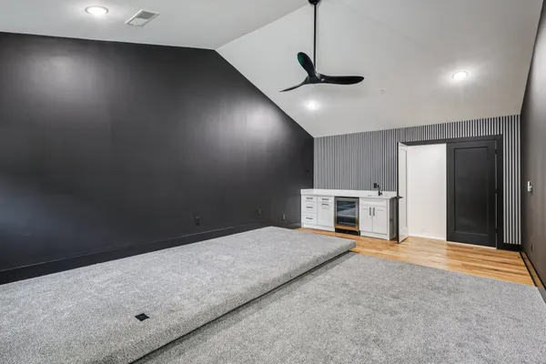 a view of a room with wooden floor and closet