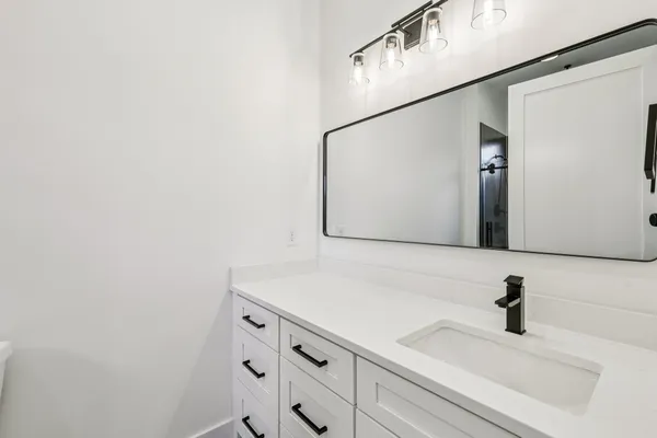 a aerial view of a house with a yard table and chairs