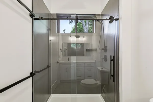 an aerial view of residential houses with outdoor space and river