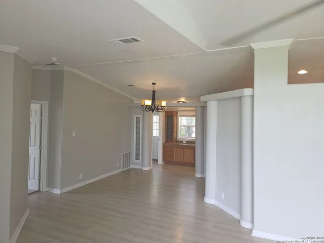 a view of a chandelier in a room and window