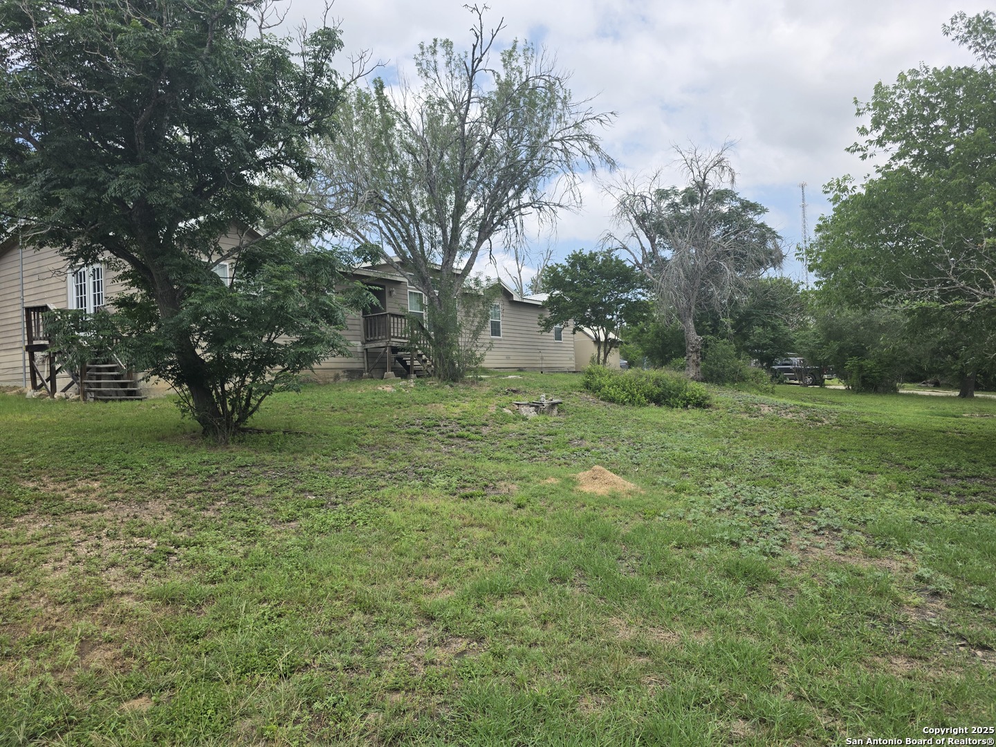 7940 County Road 279 Rio Medina, TX 78066 - Photo 29 of 33 a big yard with lots of green space and fountain