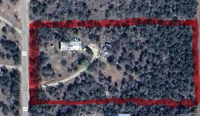 a bathroom with a shower curtain and a sink