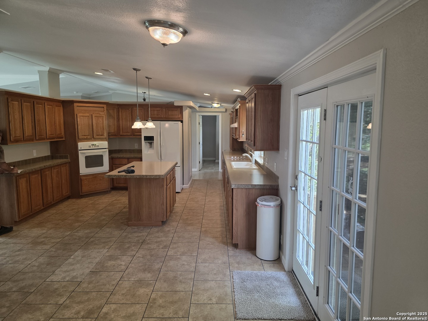 7940 County Road 279 Rio Medina, TX 78066 - Photo 4 of 33 a kitchen with refrigerator and cabinets
